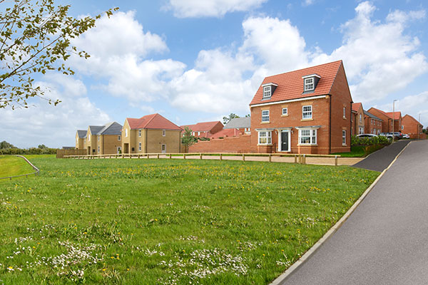 red brick house and green space